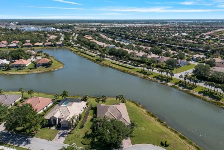 Aerial view featuring a water view and a residential view