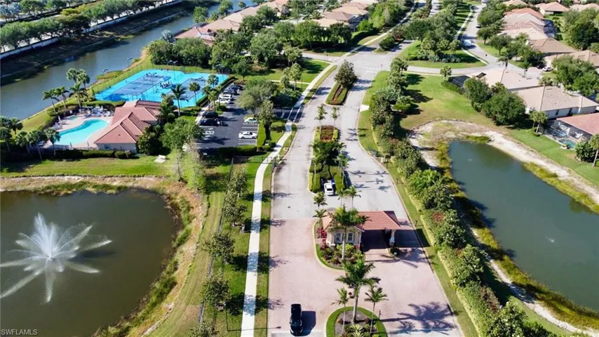 Drone / aerial view featuring a residential view and a water view