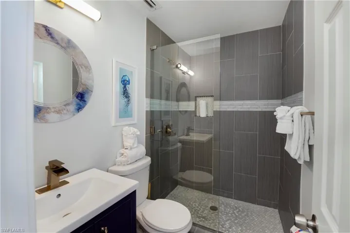 Bathroom with a walk in shower and vanity - Virtually Edited Image