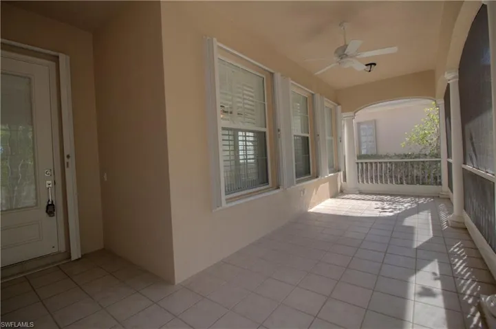 View of patio featuring ceiling fan