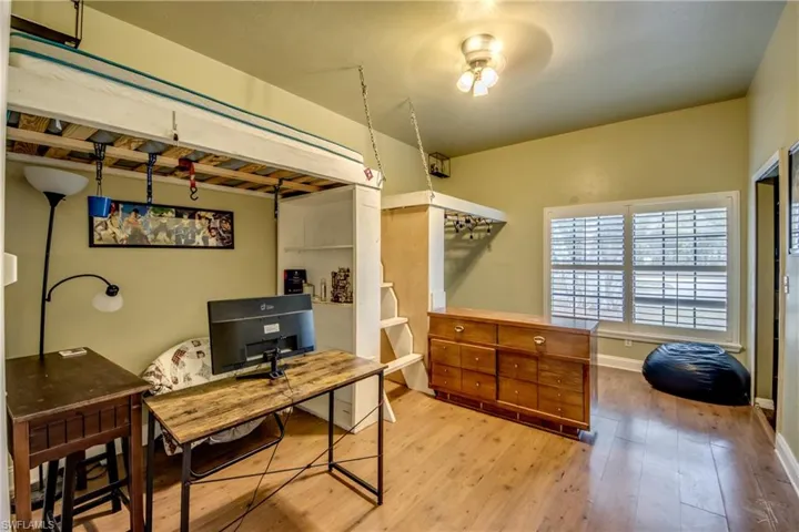 Office area featuring hardwood / wood-style flooring and baseboards