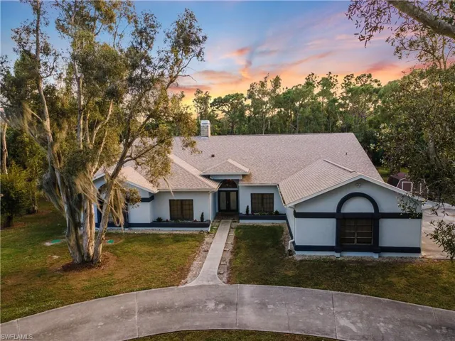 View of front of house with gorgeous sunset
