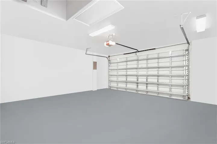 Garage featuring a garage door opener