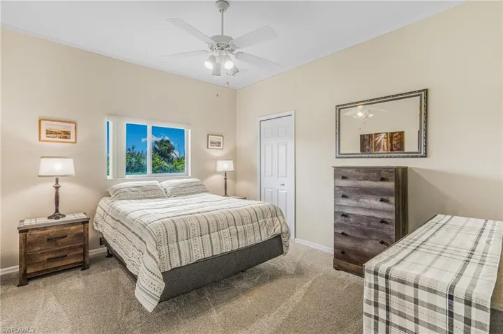 Bedroom featuring carpet floors and ceiling fan