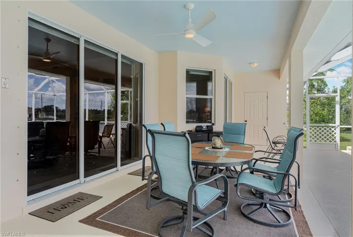 View of patio featuring ceiling fan