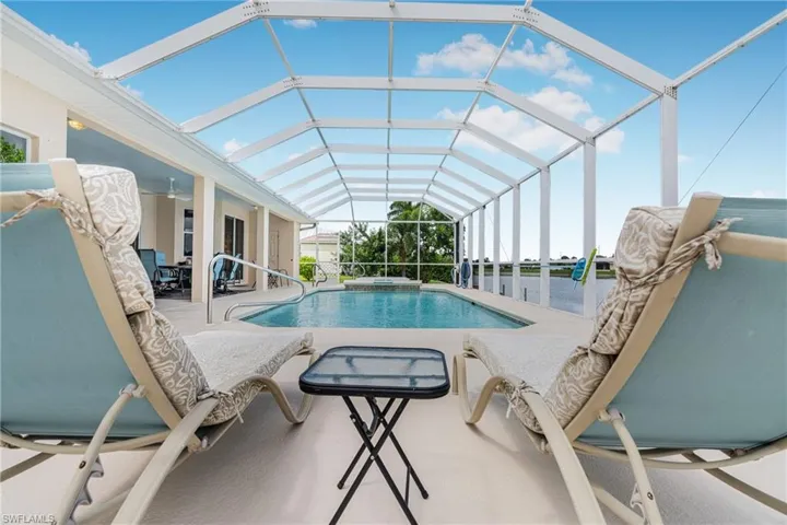 View of pool featuring a lanai and a patio area