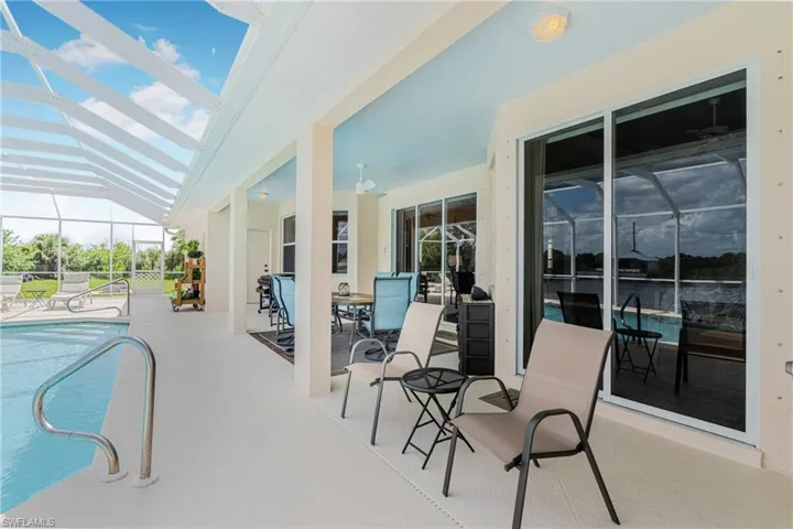 View of pool featuring a lanai and a patio area