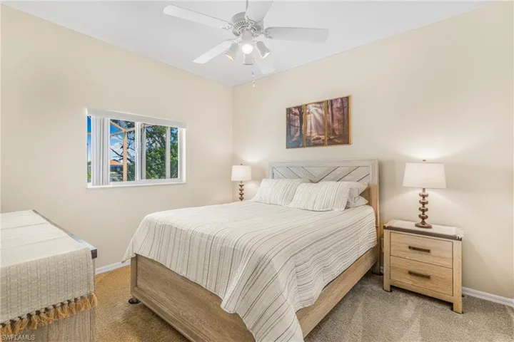 Bedroom with carpet and ceiling fan