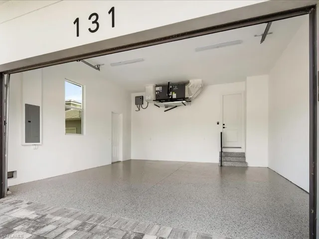 Garage featuring electric panel
