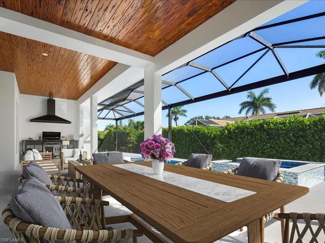 View of patio / terrace with area for grilling, glass enclosure, a sunroom, outdoor dining area, and an outdoor pool
