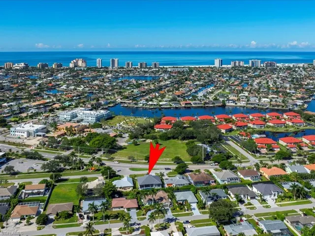 View of property location with nearby suburban area and a large body of water