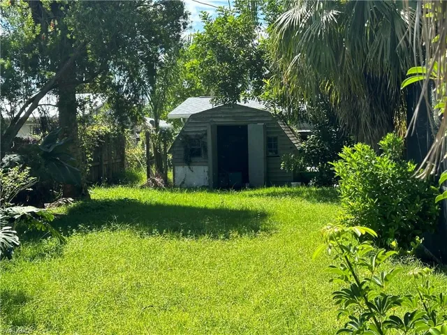 View of yard featuring a storage unit