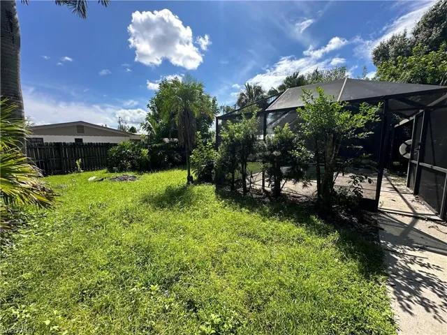 View of yard featuring a lanai