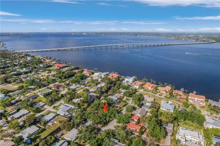 Aerial view featuring a residential view and a water view