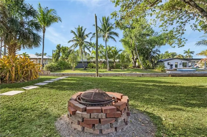 View of yard featuring a fire pit