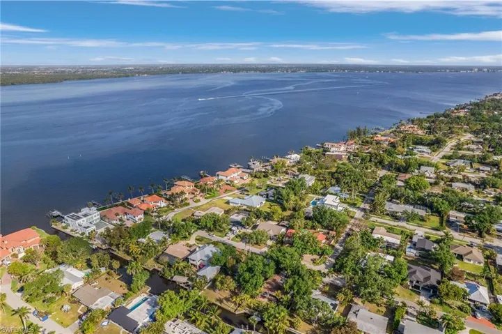 Birds eye view of property featuring a residential view and a water view