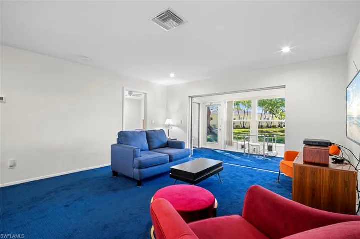 Living room with carpet and recessed lighting