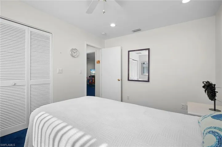Bedroom featuring ceiling fan, a closet, and recessed lighting