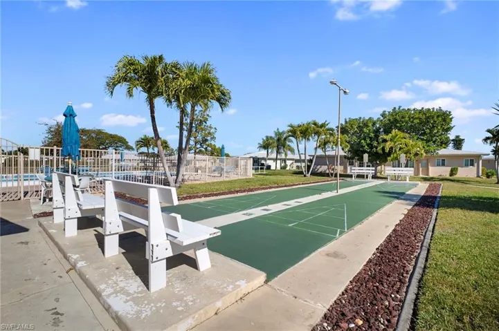 View of home's community featuring shuffleboard