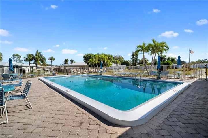 Community pool with a patio area