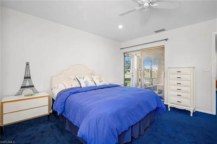 Carpeted bedroom with access to exterior, ceiling fan, and recessed lighting