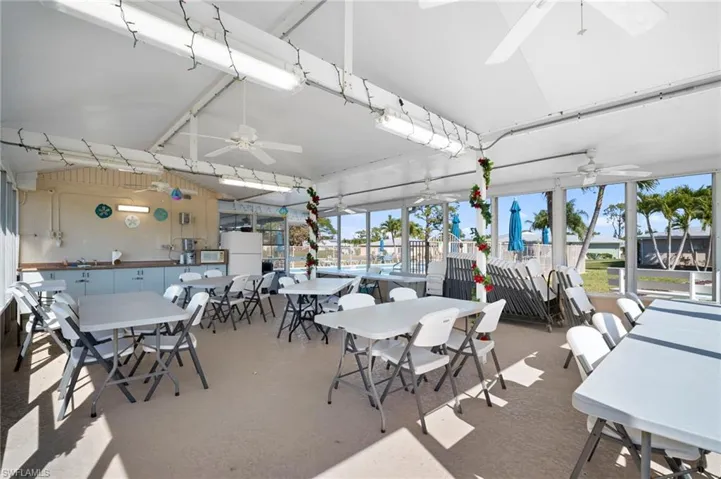 Dining area with lofted ceiling and a ceiling fan