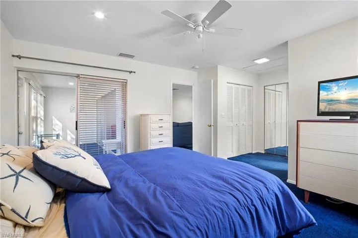 Bedroom featuring two closets, ceiling fan, carpet, and recessed lighting