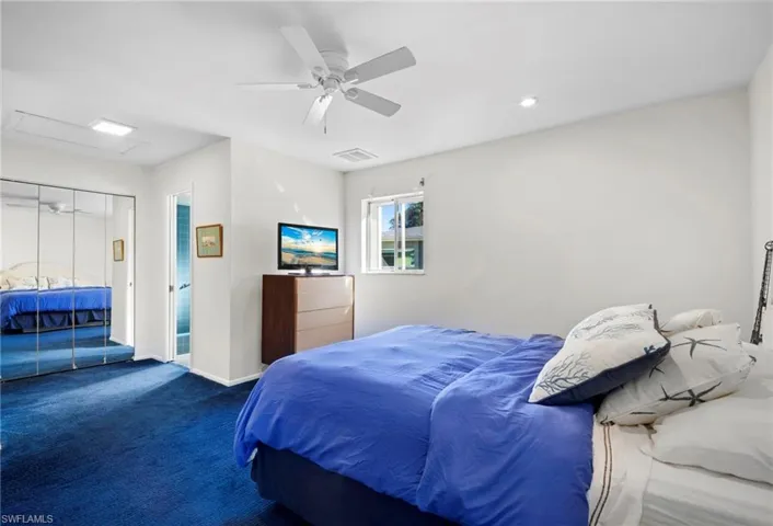 Bedroom featuring carpet and ceiling fan