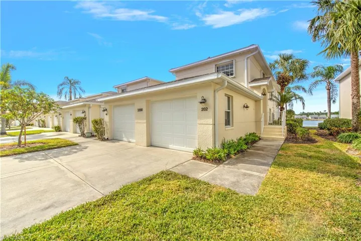 Side entry or Garage - Lush Preserve gracing the front of the home and Naples' Largest spring-fed, 37-acre lake in the back - Location, location, location! Silence reigns supreme!