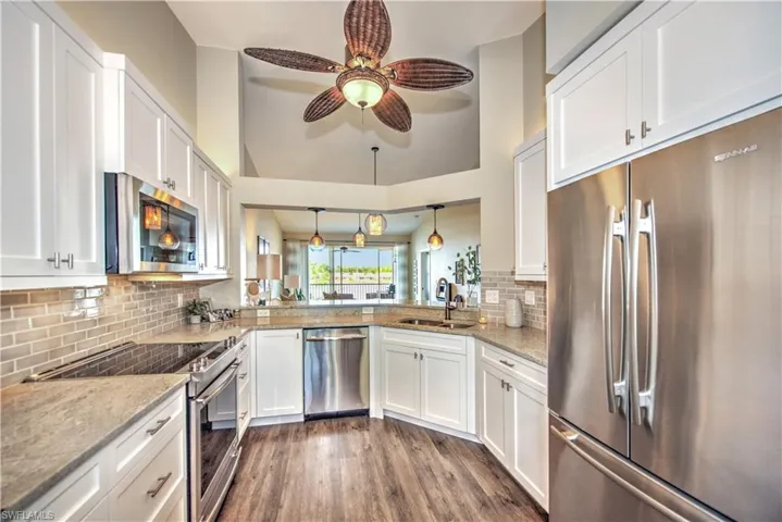 Granite countertops, custom cabinetry, solid wood 36" soft-close cupboards and drawers, crackle-glaze artisan tile backsplash...hugely impressive!