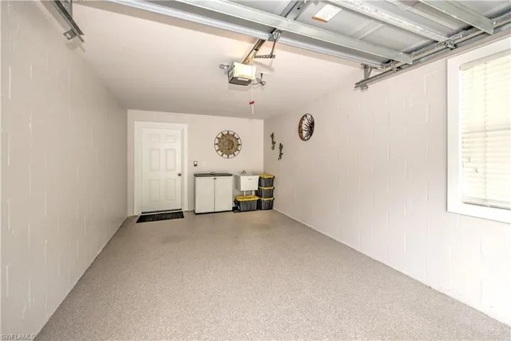 Can I just say that even the garage is fabulous - do you see that sink and the pristine epoxy luxury shine flooring?