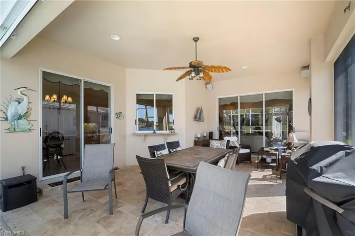 View of patio / terrace featuring outdoor dining area, ceiling fan, and area for grilling