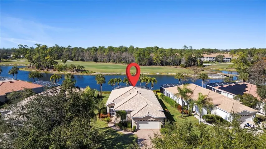 Bird's eye view of a large body of water and a local golf course