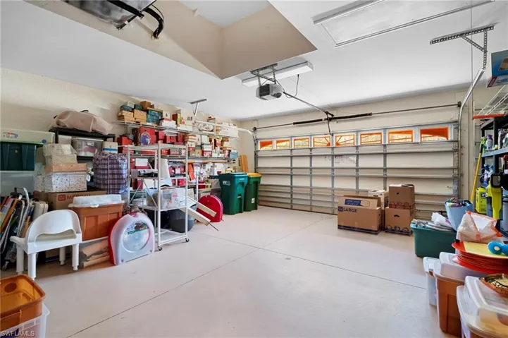 Garage featuring a garage door opener