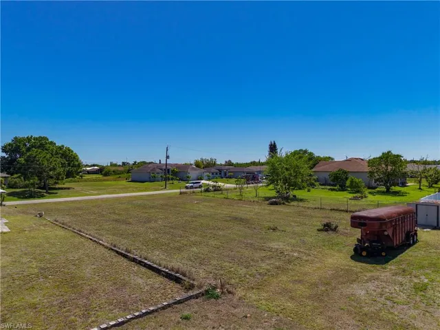 View of yard featuring fence