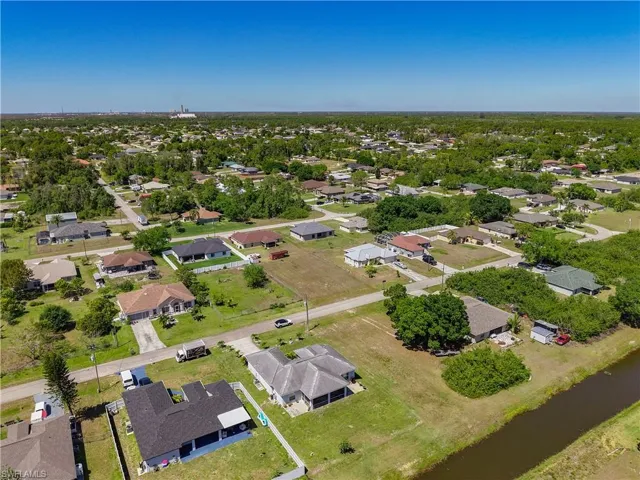 Bird's eye view with a residential view and a water view