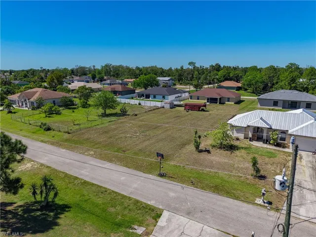 Birds eye view of property with a residential view