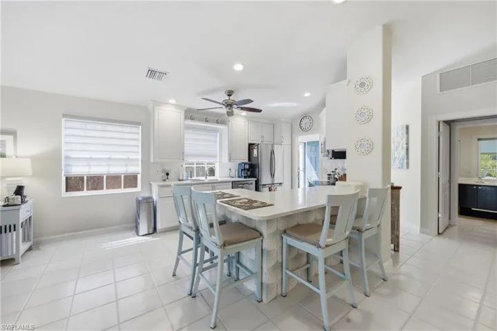 Spacious kitchen connecting seamlessly to dining and living areas.