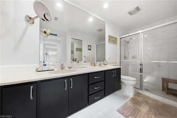 Spacious primary bathroom featuring dual sinks and generous counter space.