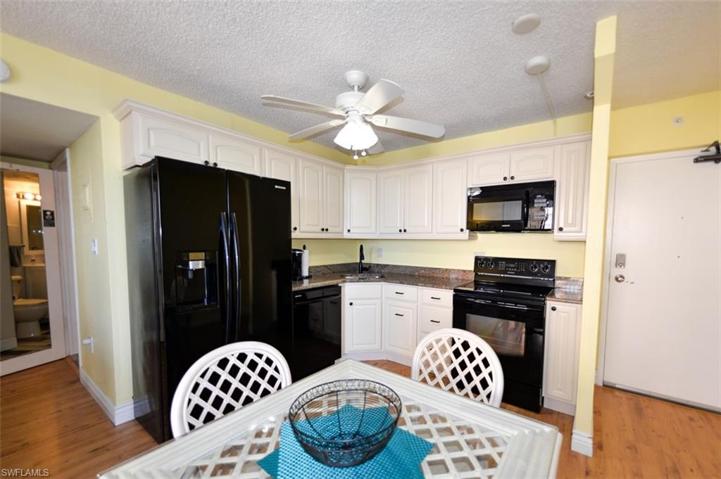 Updated wrap around kitchen in light almond color with Granite countertops. Matching Samsung appliance package includes side by side full size fridge/freezer, dishwasher, electric glass top range and overhead microwave all still under original purchase warranty.