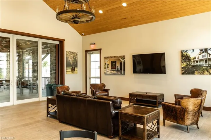 Living area with wood ceiling, light wood-style flooring, and lofted ceiling