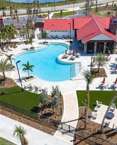 Community pool with a patio