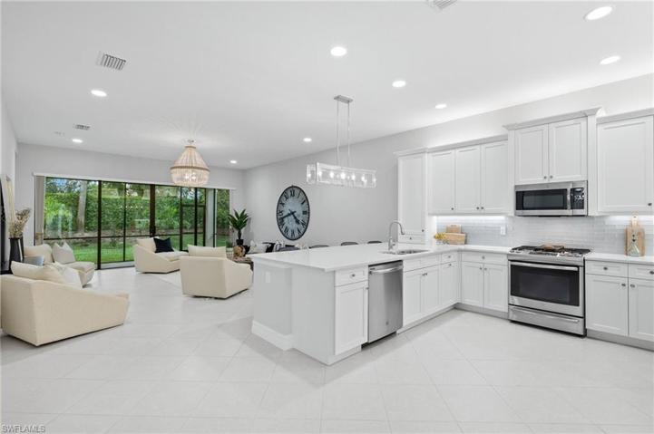 Open concept kitchen, great room and lanai