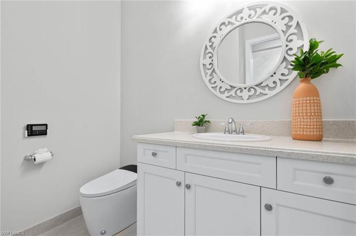 Powder room with touchless Toto toilet