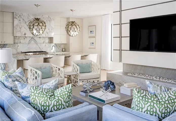 Living room with a notable chandelier and sink