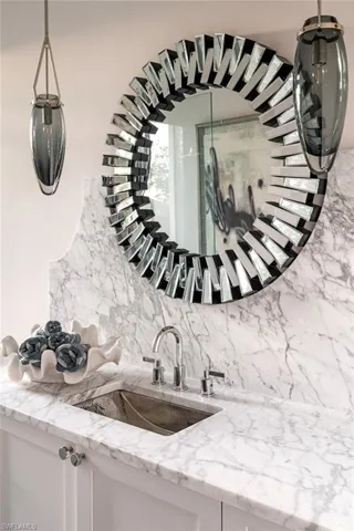 Room details with decorative backsplash and vanity