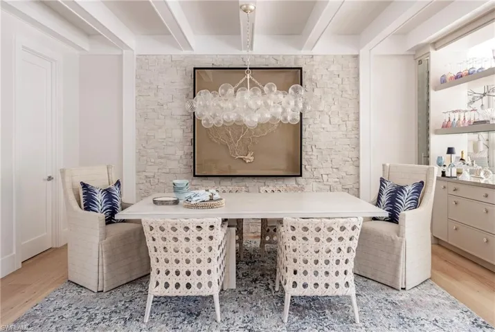 Dining room featuring a chandelier and light wood-type flooring