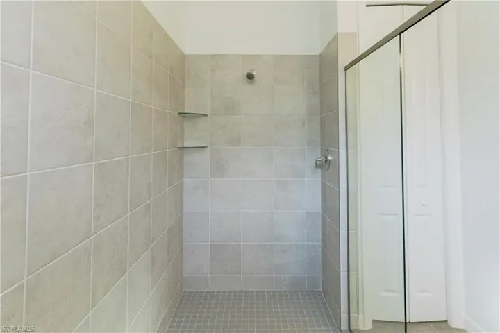 Full bath with a shower stall