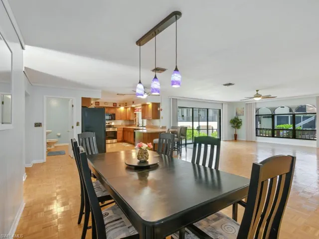 Dining area featuring pendant lighting open floor plan