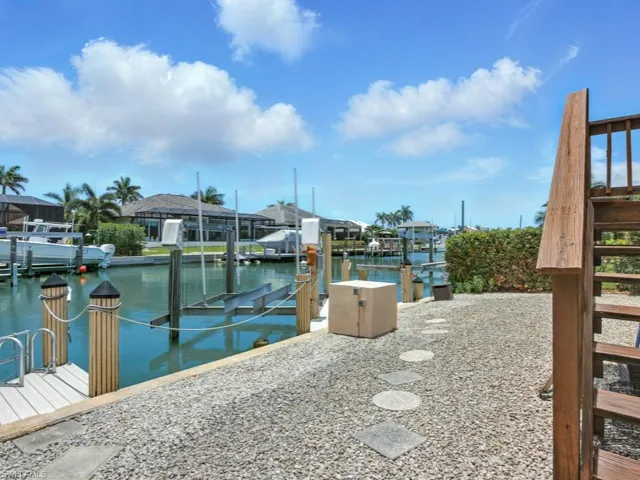 Dock area with boat lift and a water view